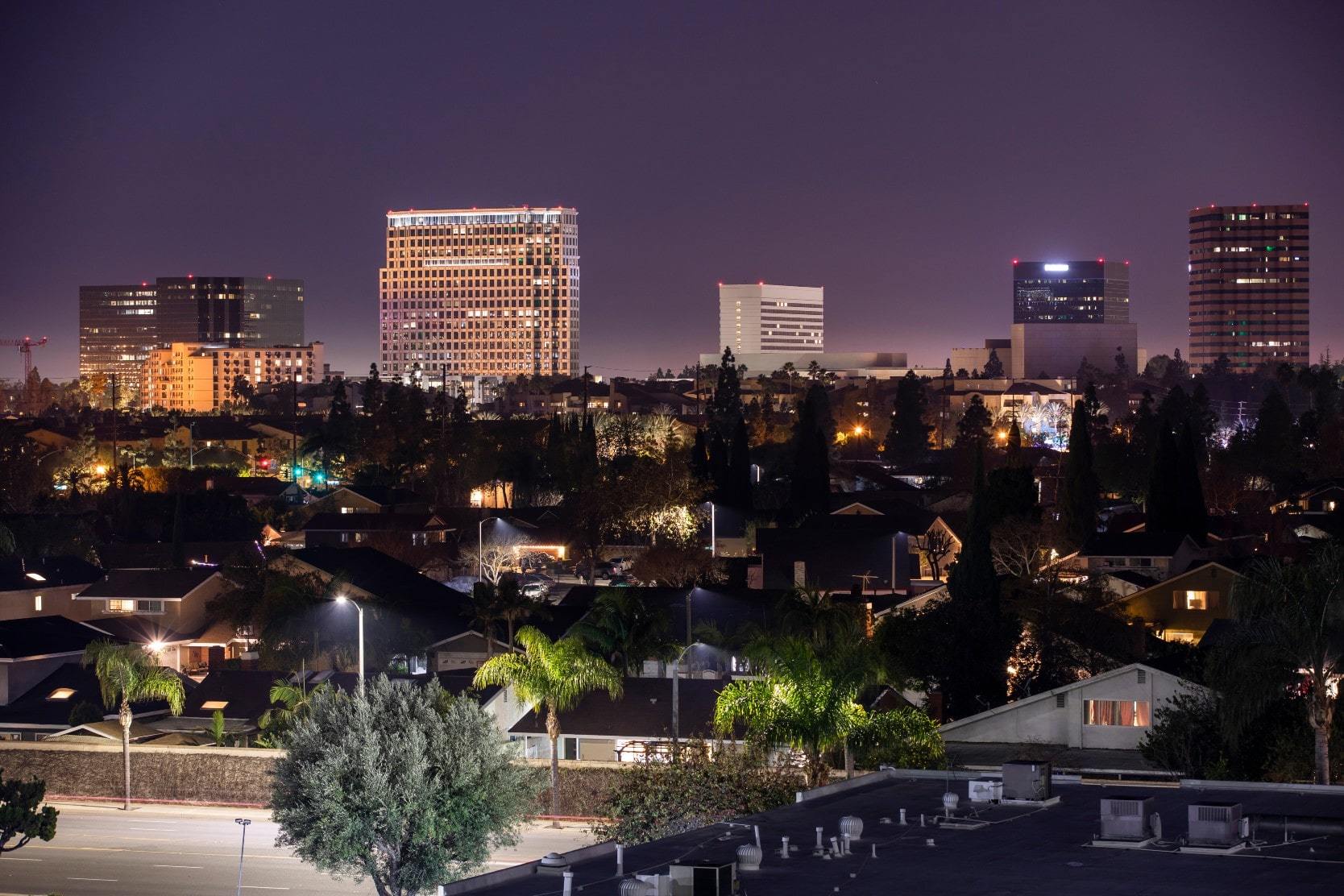 View of the skyline and prime real estate in Costa Mesa, California at night.